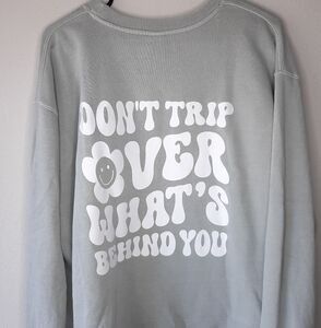 Don't trip over what's behind you crewneck xl